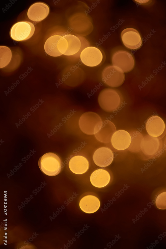 beautiful yellow bokeh lights background on dark