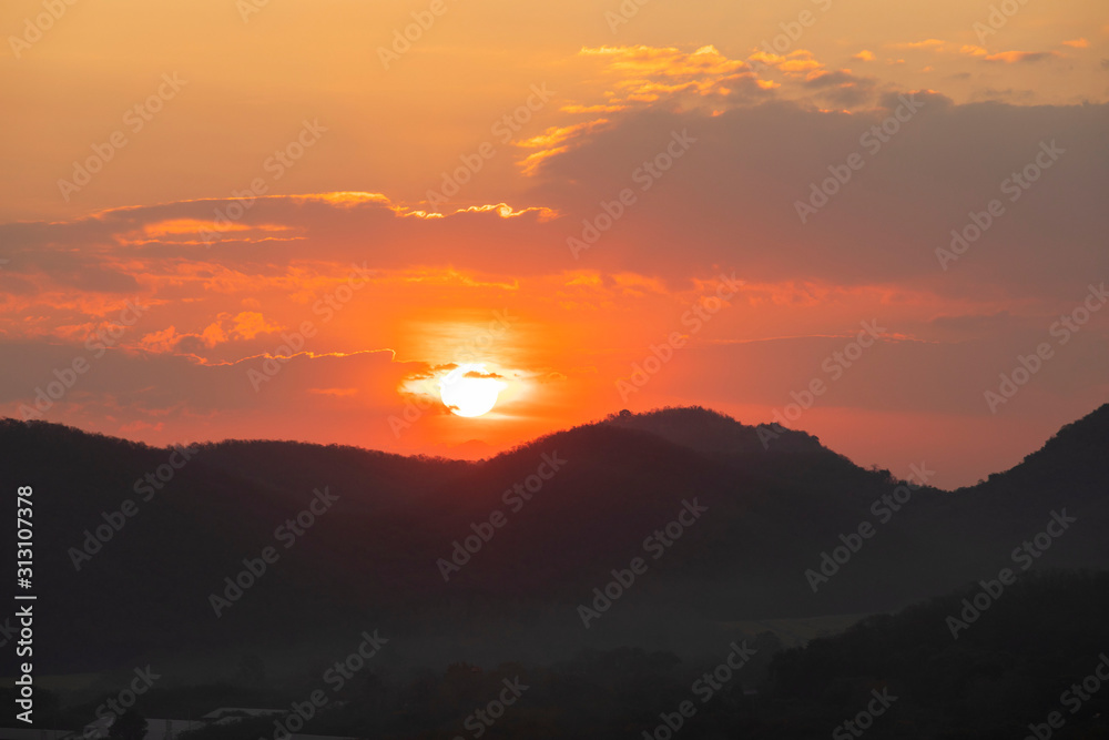 Beautiful sunrise or sunset, sunrise behind mountains