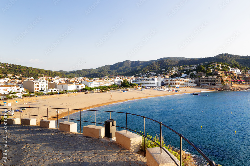 View of the city of Tossa de Mar in Spain from the walls of an old castle by the sea in the early morning.