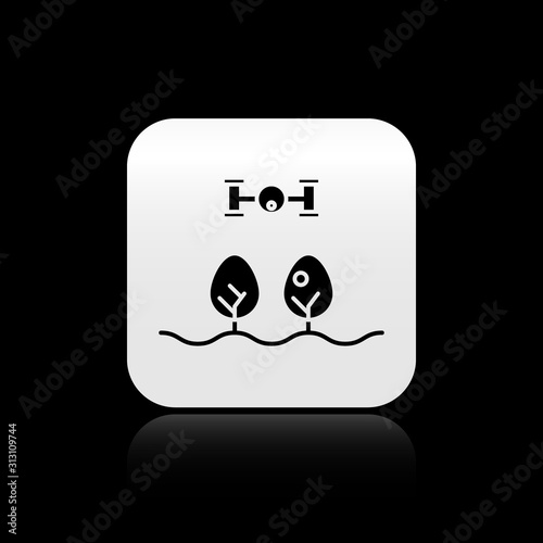 Black Smart farm with drone control and tree icon isolated on black background. Innovation technology for agricultural company. Silver square button. Vector Illustration