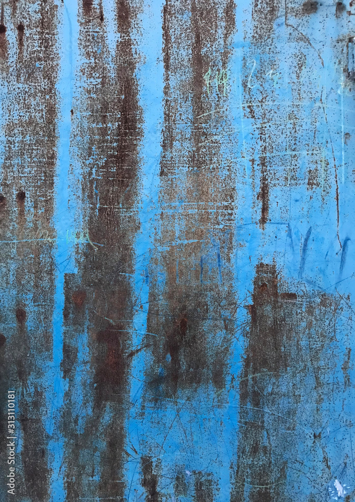 Beautiful abstract grunge decorative texture. Blue and brown wall with peeled paint close up.