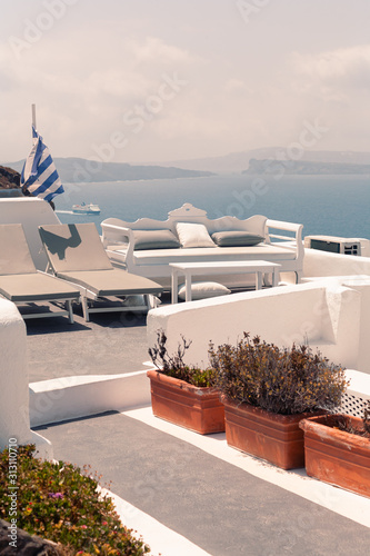 Sea view from Oia village in Santorini with ship on it at sunny weather