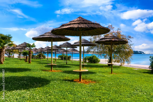 Beautiful coast of Porec with parasols on the beach promenade © EKH-Pictures