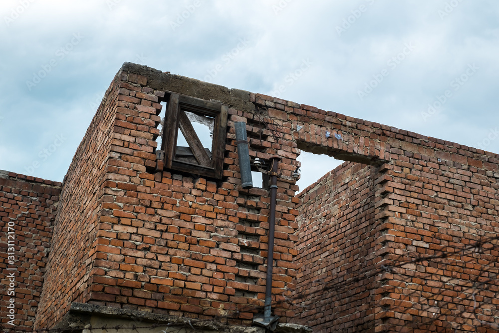 the walls of an abandoned house on cloudy sky the walls of an abandoned house on cloudy sky