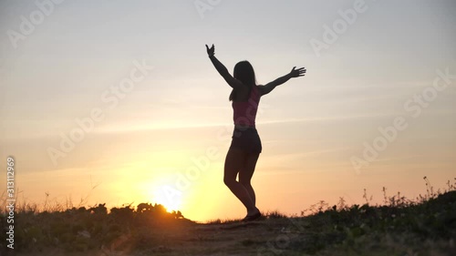Wallpaper Mural Happy woman jumping on beach enjoying sunset on summer travel vacation holiday. Happiness and bliss concept video with female jumping of joy celebrating in silhouette. SLOW MOTION 4k Torontodigital.ca