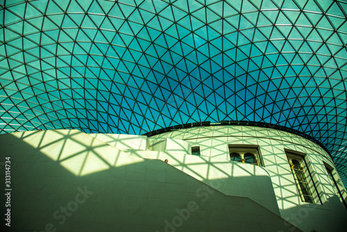 blue sky  stairway and shadow of ceiling with lone figure