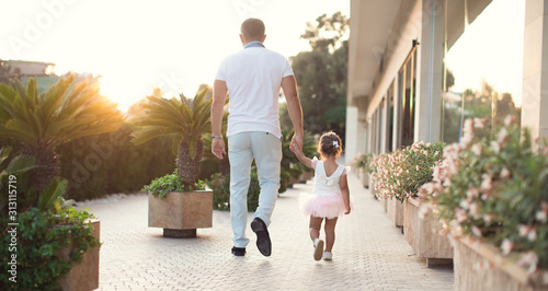 Father and daughter share love.