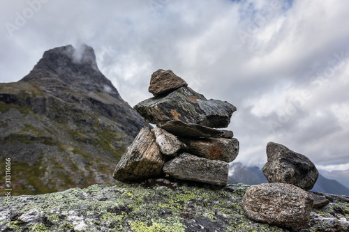 Troll rock pyramid on top of Trollstigen road. Stone cairn among a mountain landscape in Norway © Kathrine Andi
