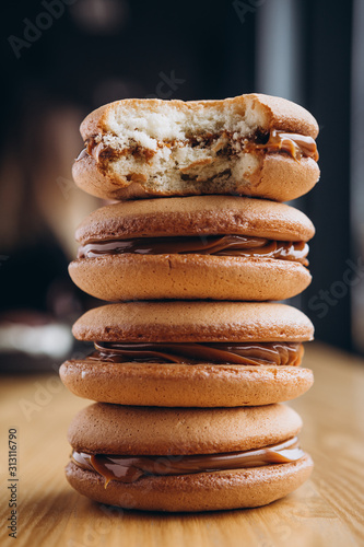 Close up Traditional chocolate and Pumpkin Whoopie pies made with vanilla cream cheese. Background for bakeries, cafes, restaurants photo