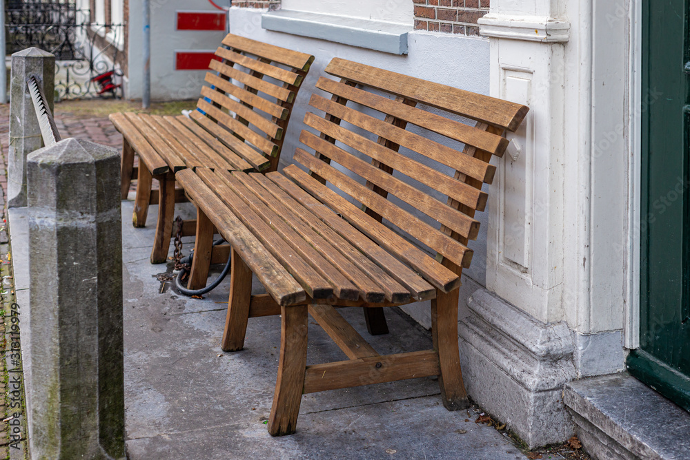 Wooden bench on the street of Leiden, Netherlands Wooden bench on the street of Leiden, Netherlands