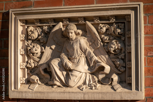 Stone statue of an angel on a german graveyard in Berlin photo