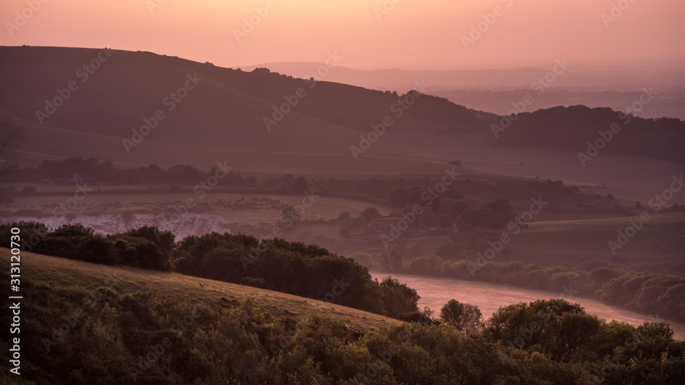 Hills in East Sussex with layers of mist viewed from Butts Brow in the South Downs National Park
