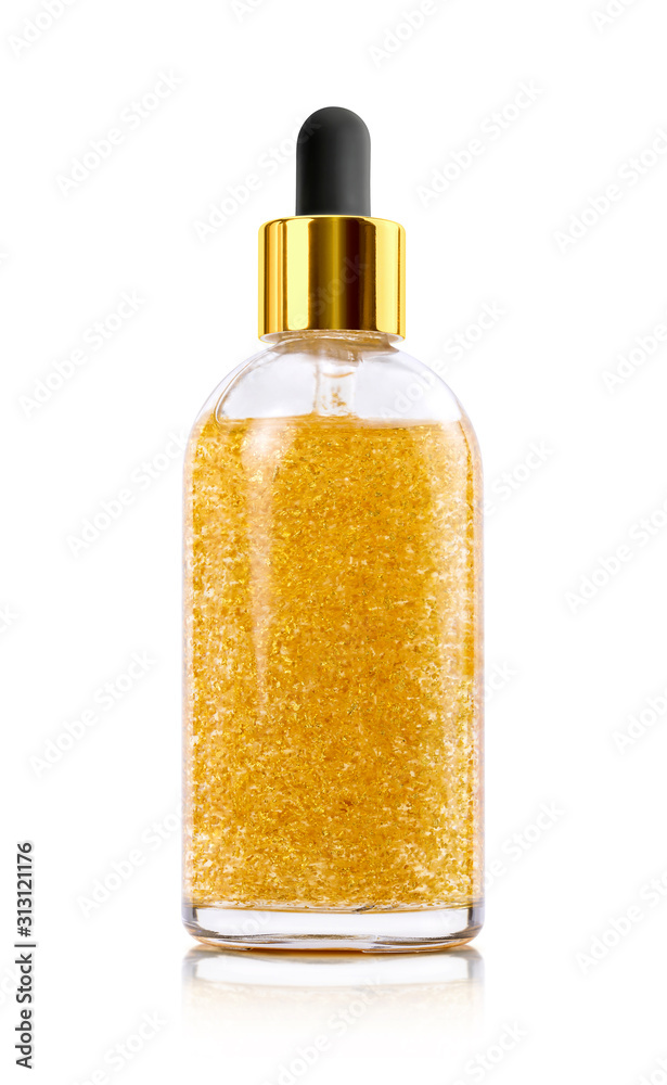 Golden serum in glass bottle isolated on white background Golden serum in glass bottle isolated on white background