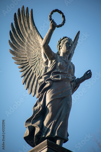 Fotografie Stone statue of an angel on a german graveyard in Berlin