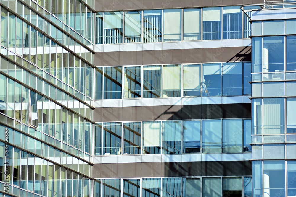 The windows of a modern building for offices. Business buildings architecture. The windows of a modern building for offices. Business buildings architecture.