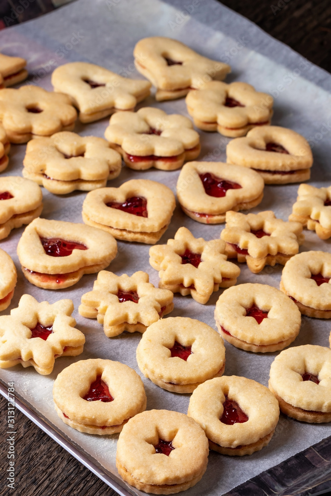 Linzer Christmas cookies filled with red currant marmalade