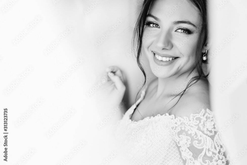 Beautiful bride in white dress look at camera and smile