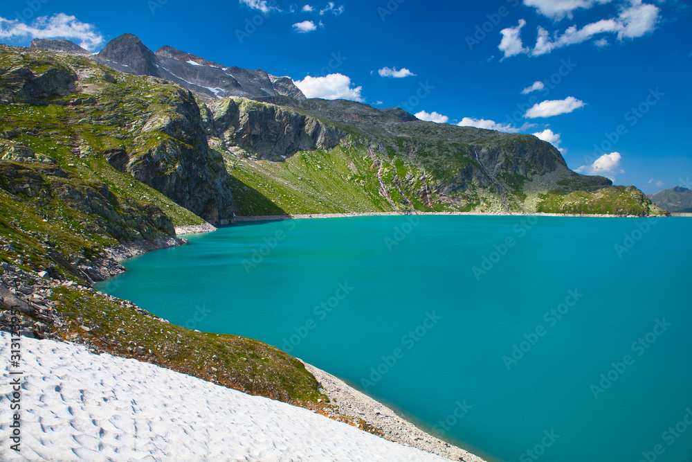 blue artifical lake in the mountains