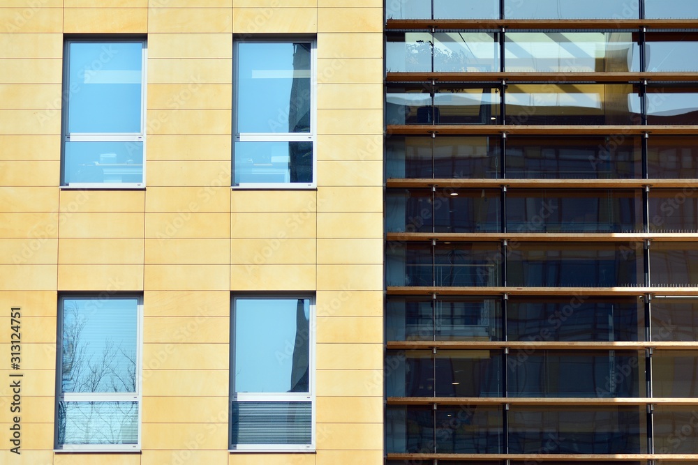 The windows of a modern building for offices. Business buildings architecture. The windows of a modern building for offices. Business buildings architecture.