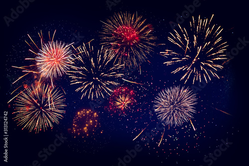Abstract color fireworks display on dark sky background