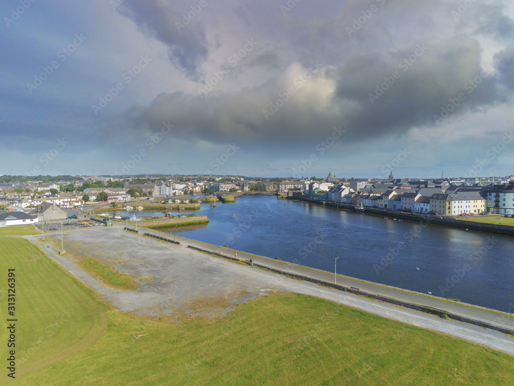 Aerial view on Galway city, river Corrib, Claddagh area, Sunny day, Cloudy sky. Aerial view on Galway city, river Corrib, Claddagh area, Sunny day, Cloudy sky.