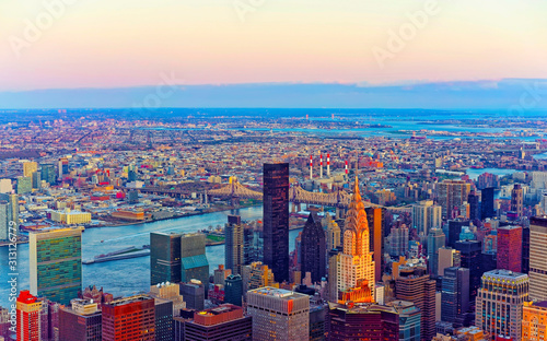 Panoramic view on Midtown district of Manhattan in New York, NYC. East river and Queensboro Bridge in Long Island City. Skyline, USA. American architecture building. Aerial Panorama of Metropolis.