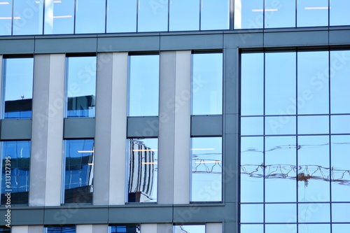 The windows of a modern building for offices. Business buildings architecture.