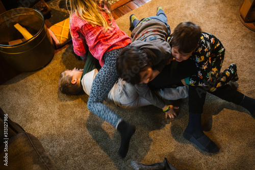 Kids wrestling in living room