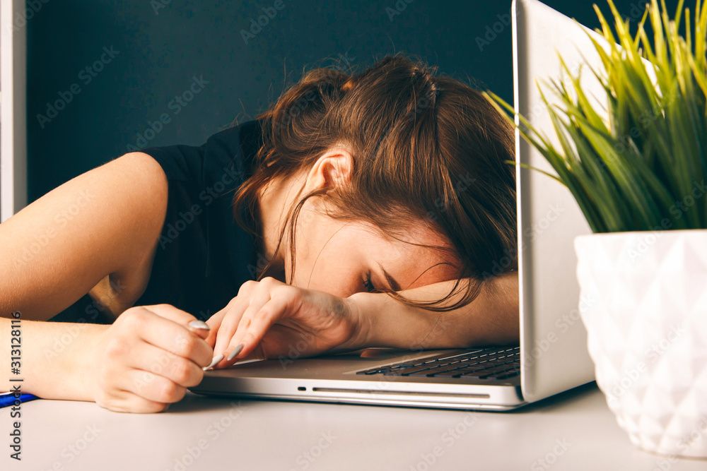 Bored sleepy woman tired. Office worker sleeping at her desk - obrazy, fototapety, plakaty 