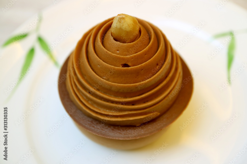 Bitter and Sweet Chocolate Mousse Cake Topped with Hazelnut Bitter and Sweet Chocolate Mousse Cake Topped with Hazelnut