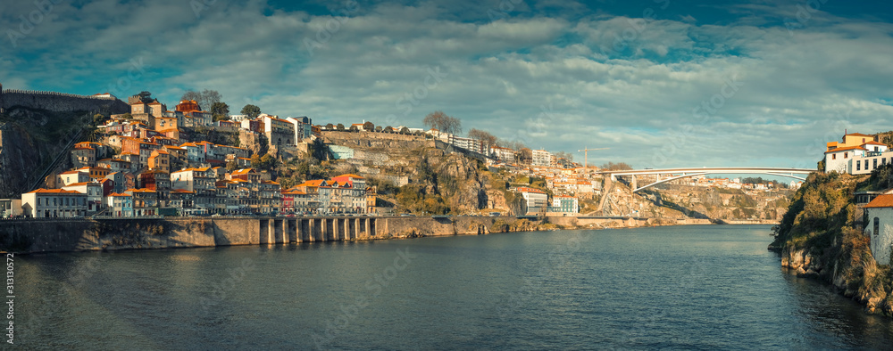 panorama with old fishing houses on a hill next to the funicular in Ribeira district on the banks of the Douro River in the city of Porto in Portugal