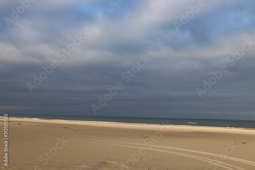 Wheel tracks in the sand on a cold November day. Blokhus Beach