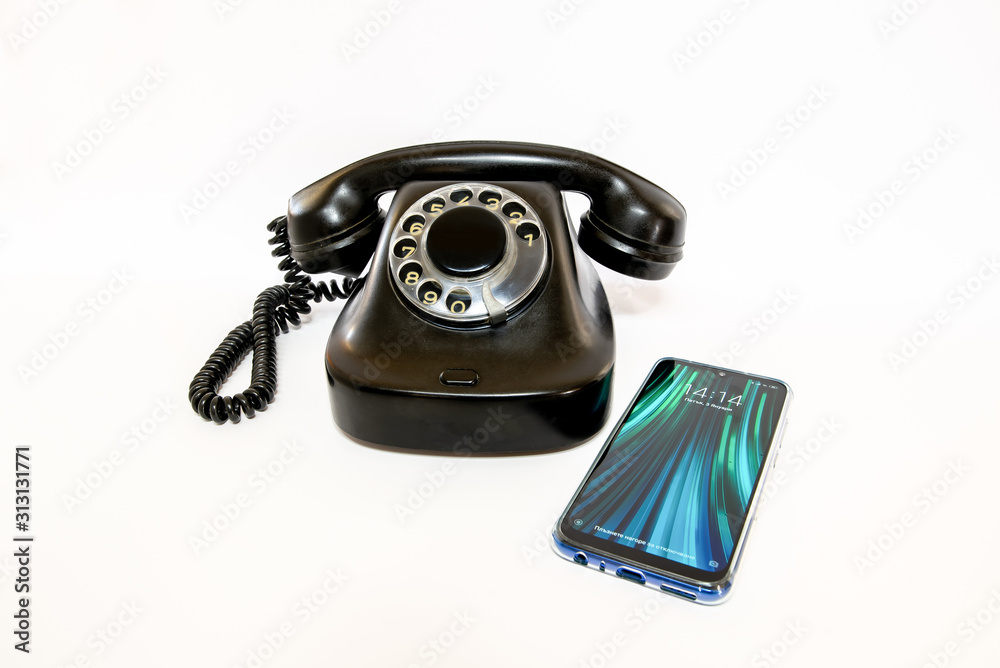 Big and clunky old phone with a rotary dial next to a thin and compact  smartphone. Concept of technology advancement in telecommunications and  portability. Stock-Foto | Adobe Stock