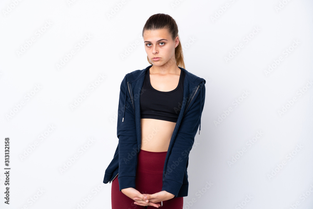 Teenager sport girl over isolated white background stretching arm