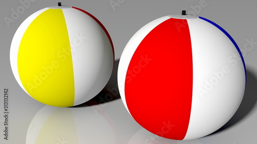 Two beach balls in various colors