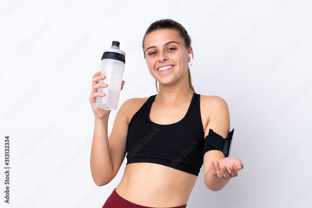 Teenager sport girl over isolated white background with sports water bottle Teenager sport girl over isolated white background with sports water bottle