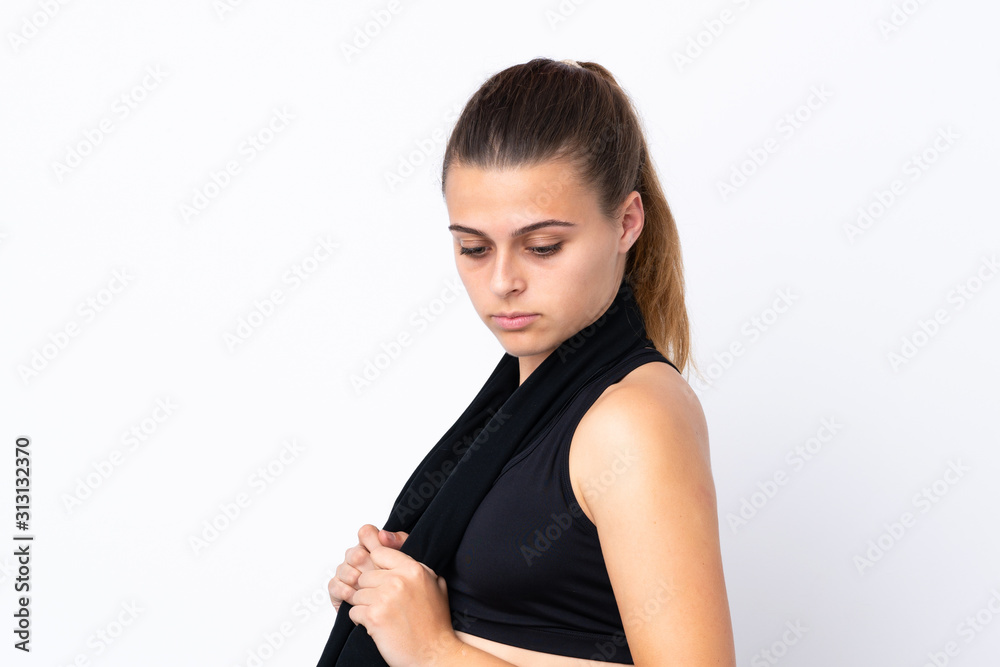 Teenager sport girl over isolated white background with sport towel Teenager sport girl over isolated white background with sport towel