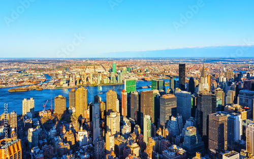 Panoramic view on Midtown district of Manhattan in New York, NYC. East river and Queensboro Bridge in Long Island City. Skyline, USA. American architecture building. Aerial Panorama of Metropolis. © Roman Babakin