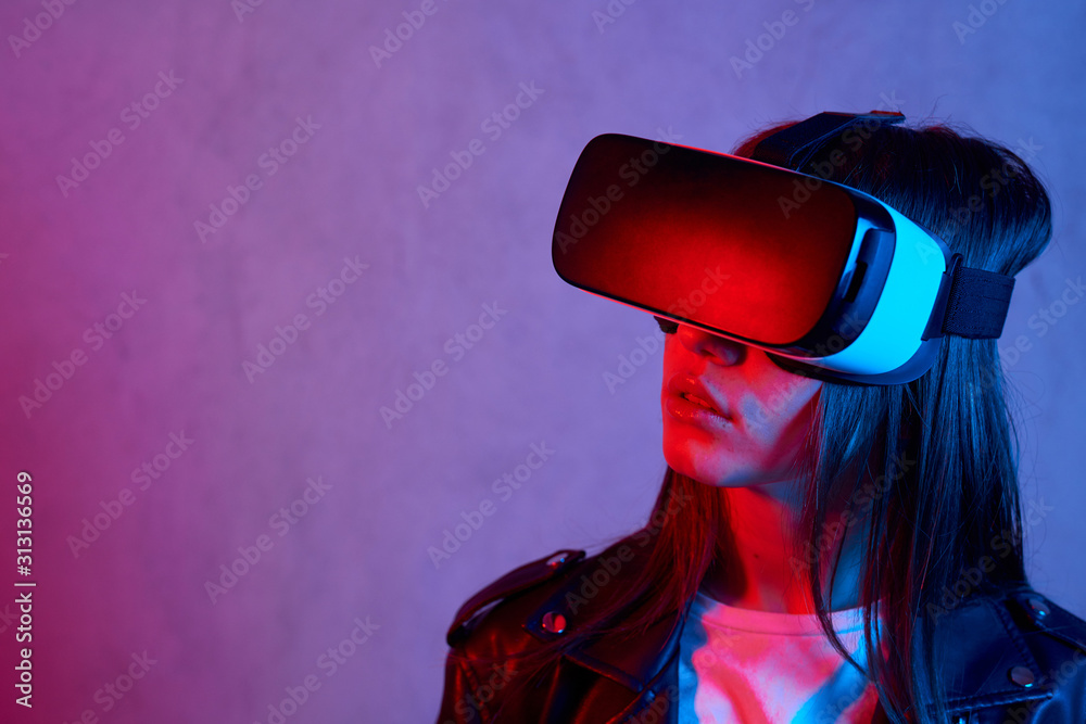 Young girl using virtual reality helmet while wearing a jacket Young girl using virtual reality helmet while wearing a jacket