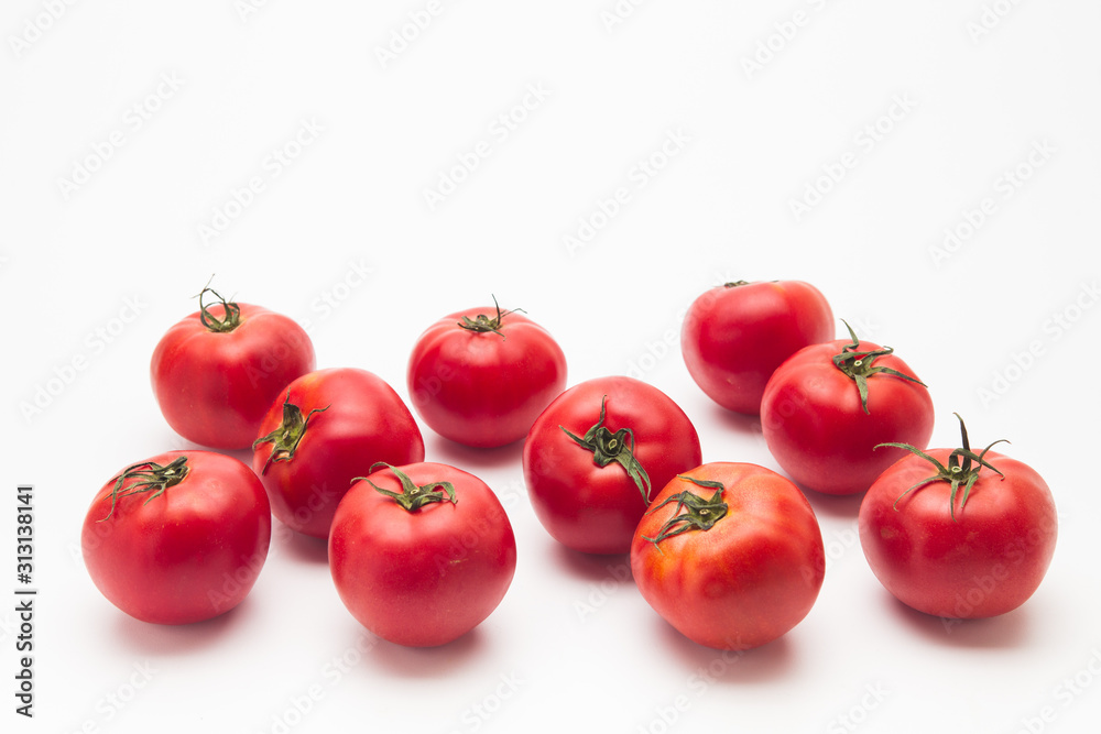 Fresh red tomatoes on white background