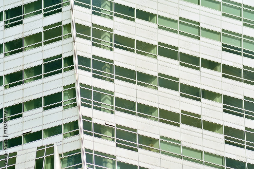 The windows of a modern building for offices. Business buildings architecture. The windows of a modern building for offices. Business buildings architecture.