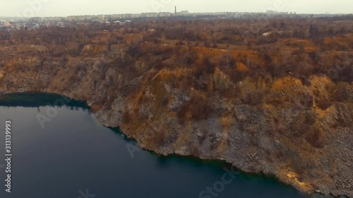 Mountain lake aerial drone movement from above photo