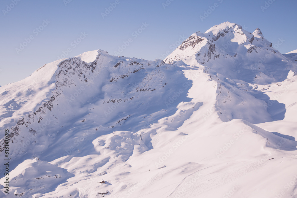 Natural scenery, snow on the high mountains in the cold winter of GRINDELWALD-FIRST TOP OF ADVENTURE SWITZERLAND of Europe and clear skies for skiing or walking. Beauty in Europe.