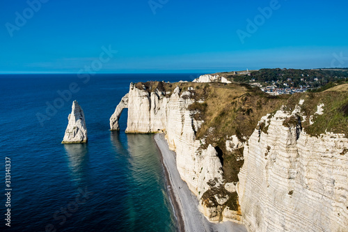The pointed formation called L'Aiguille or the Needle with so-called Porte d'Aval in the village of Etretat, Wednesday 16 August 2017, Etretat, France