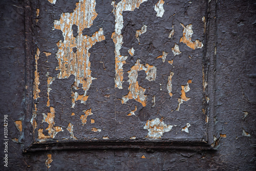Darkly ragged wooden vintage door
