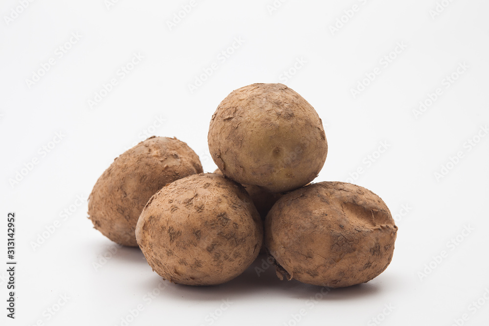 Raw potatoes on white Raw potatoes on white