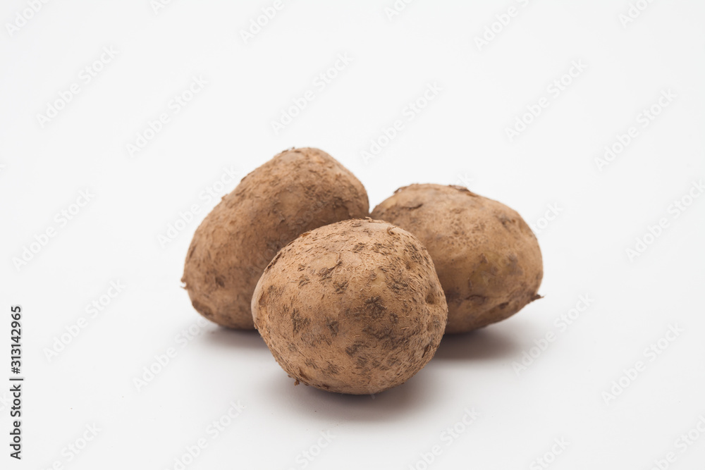 Raw potatoes on white Raw potatoes on white