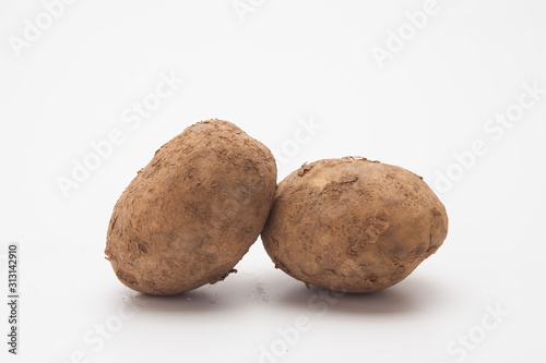 Raw potatoes on white 
