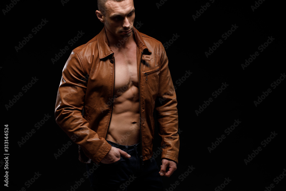 Young handsome man, leather jacked on naked torso, emotional posing, lifestyle people concept