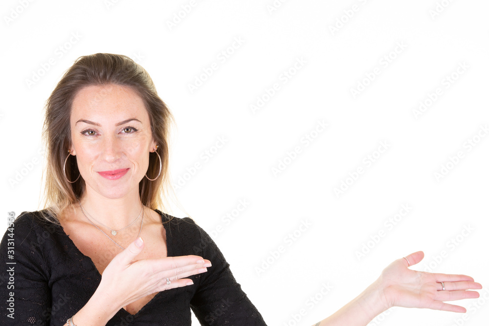 Young woman with black sweater over isolated white background extending hands to aside inviting to come in Young woman with black sweater over isolated white background extending hands to aside inviting to come in